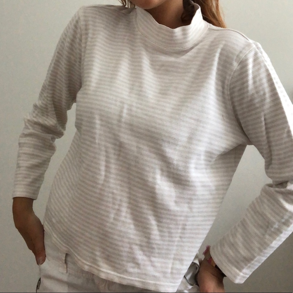 white turtle neck with gold stripes. size petite L